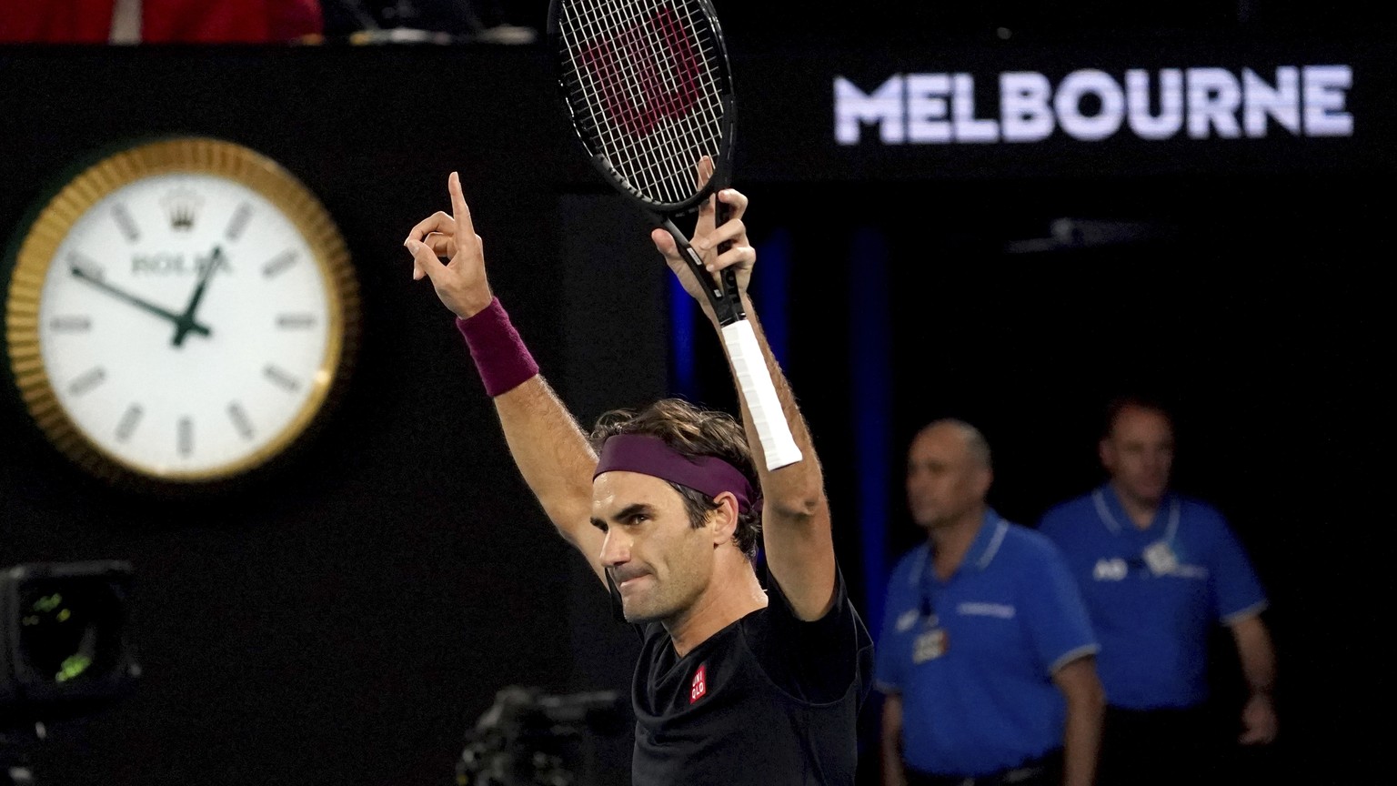 Switzerland&#039;s Roger Federer celebrates after defeating Australia&#039;s John Millman in their third round match at the Australian Open tennis championship in Melbourne, Australia, Saturday, Jan.  ...