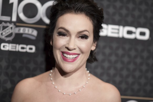 Alyssa Milano arrives at the The NHL100 Gala held at the Microsoft Theater on Friday, Jan. 27, 2017, in Los Angeles. (Photo by Richard Shotwell/Invision/AP)