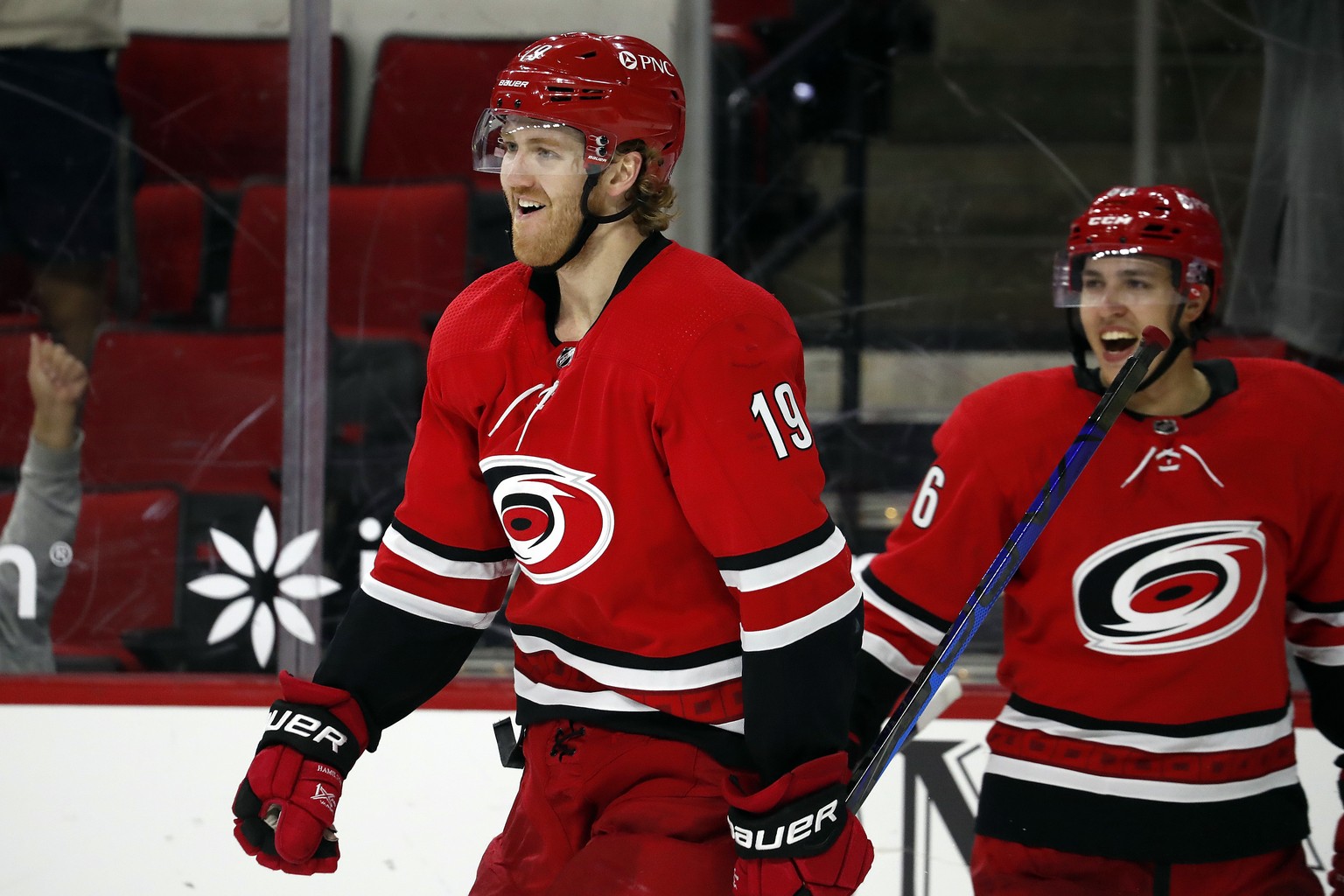 Carolina Hurricanes&#039; Dougie Hamilton (19) celebrates his game-winning goal with teammate Teuvo Teravainen (86) in overtime of an NHL hockey game against the Columbus Blue Jackets in Raleigh, N.C. ...