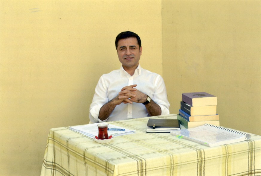 In this handout photo provided by the pro-Kurdish Peoples&#039; Democratic Party (HDP), former co-leader of the party Selahattin Demirtas sits in prison in Turkey, Friday, May 4, 2018. The HDP announc ...