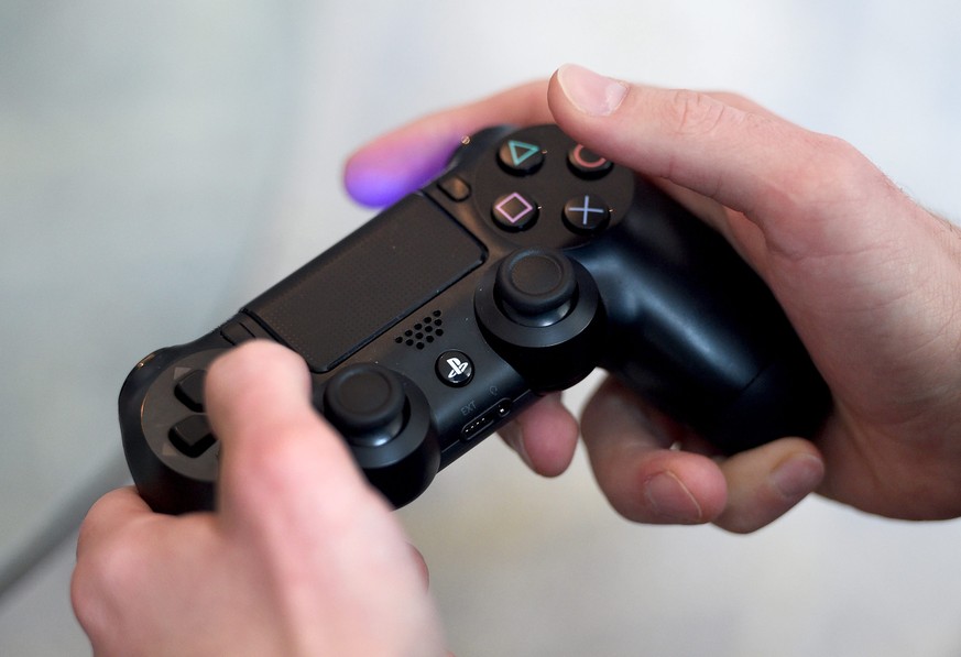 epa05623850 A Sony Playstation 4 Pro is tested with a gaming consol during a PS4 Pro premiere event in Berlin, Germany, late 08 November 2016. The teams from Sony Interactive Entertainment Deutschland ...