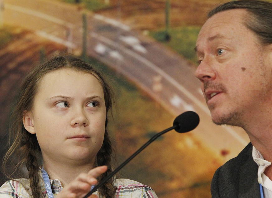 Swedish 15-year old climate activist, Greta Thunberg and her father Svante attend a press conference during the Climate Change Conference COP24 in Katowice , Poland, Tuesday, Dec. 4, 2018.(AP Photo/Cz ...