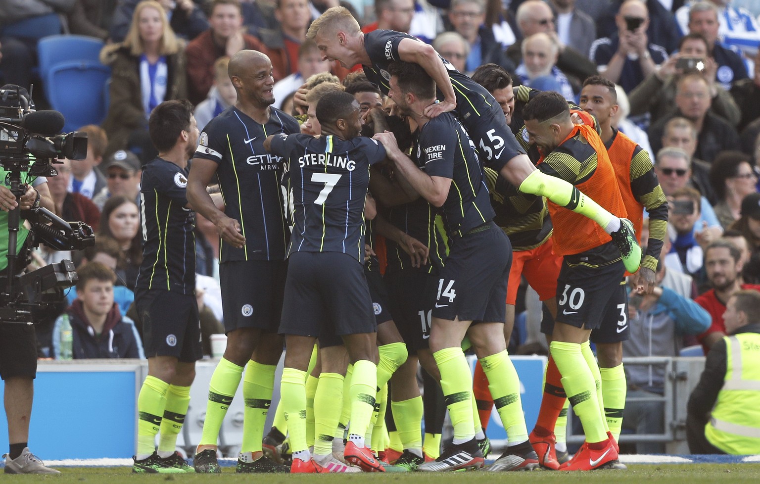 Manchester City players celebrate their third goal during the English Premier League soccer match between Brighton and Manchester City at the AMEX Stadium in Brighton, England, Sunday, May 12, 2019. ( ...