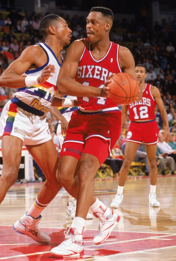 DENVER - 1989: Rick Mahorn #44 of the Philadelphia 76ers drives against Alex English #2 of the Denver Nuggets during the 1989-1990 NBA season game at the McNichols Arena in Denver, Colorado. (Photo by ...