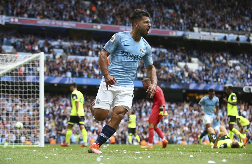 Manchester City&#039;s Sergio Aguero celebrates scoring his side&#039;s third goal of the game during the English Premier League soccer match between Manchester City and Huddersfield Town at the Etiha ...