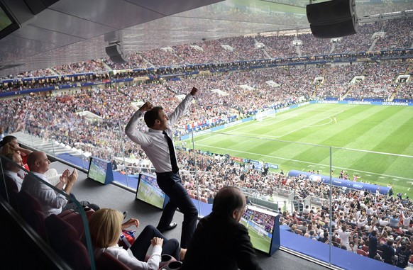epa06891156 French President Emmanuel Macron (C) reacts as Russian President Vladimir Putin (L) and FIFA President Gianni Infantino (2-L) watch during the FIFA World Cup 2018 final between France and  ...