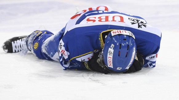 Davos&#039; Felicien du Bois lies on the ice during the game between HC Davos and Haemeenlinna PK at the 91th Spengler Cup ice hockey tournament in Davos, Switzerland, Friday, December 29, 2017. (KEYS ...