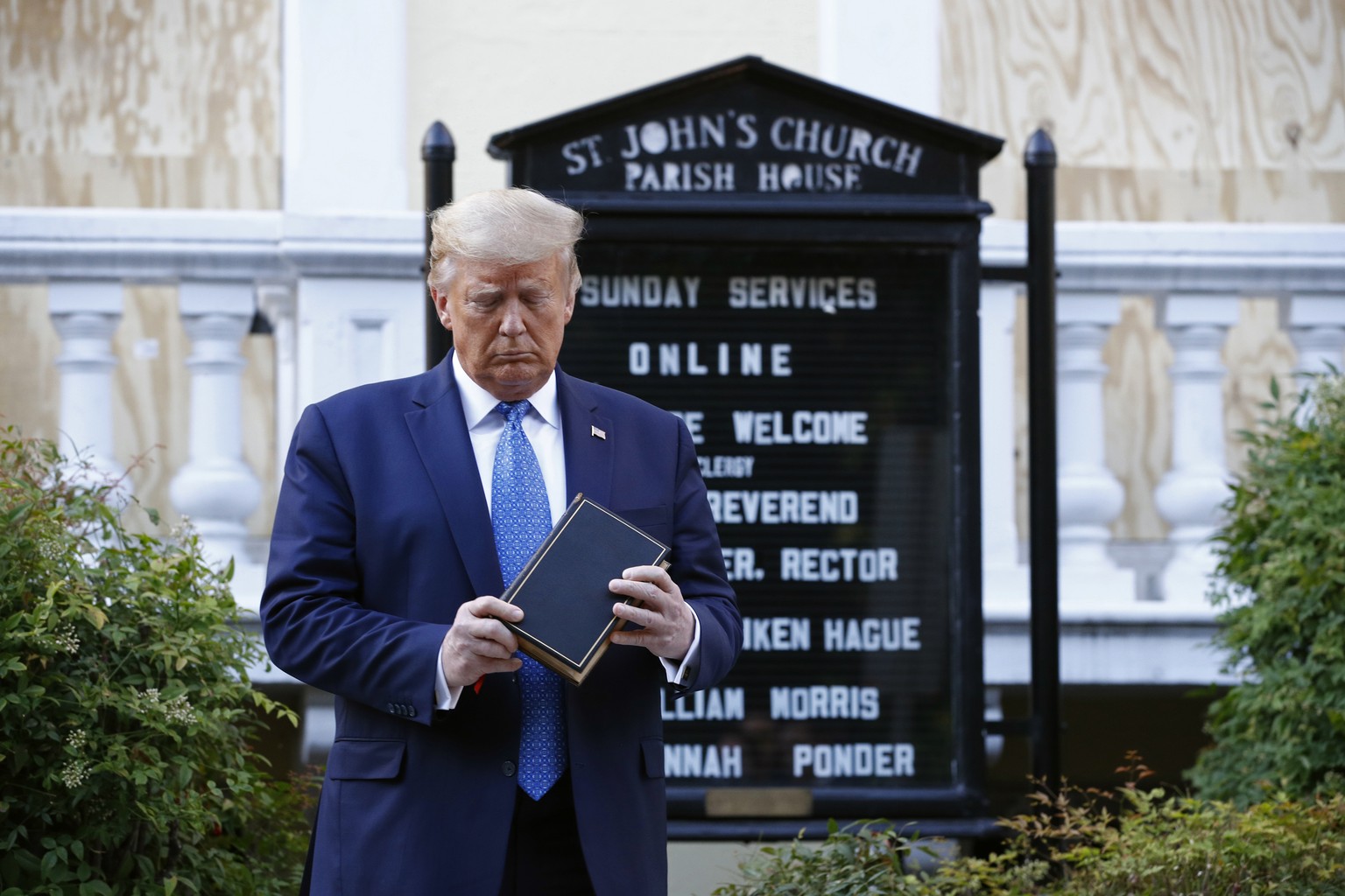 FILE - In this Monday, June 1, 2020 file photo, President Donald Trump holds a Bible during a visit outside St. John&#039;s Church across Lafayette Park from the White House in Washington. Polling rel ...