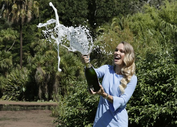 epaselect epa06479656 Caroline Wozniacki of Denmark sprays champagne while posing with her trophy for winning the women&#039;s final at the Australian Open Grand Slam tennis tournament in Melbourne, A ...