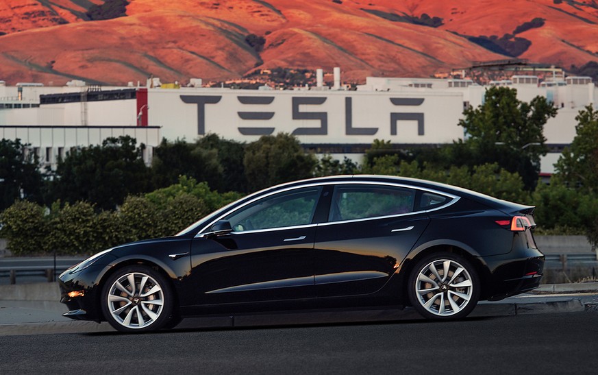 FILE - This file image provided by Tesla Motors shows the Tesla Model 3 sedan. Tesla is raising $1.5 billion as it ramps up production of its Model 3 sedan, its first mass market electric car, the com ...