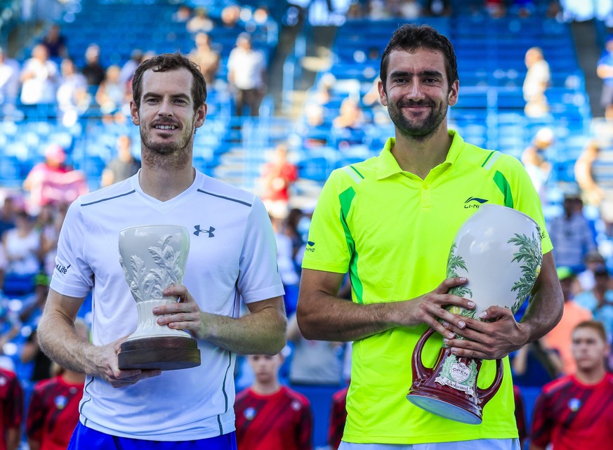 epa05506007 Marin Cilic of Croatia (R) and Andy Murray of Great Britain pose with their trophies after Cilic defeated Murray in the final of the Western &amp; Southern Open tennis championships at the ...