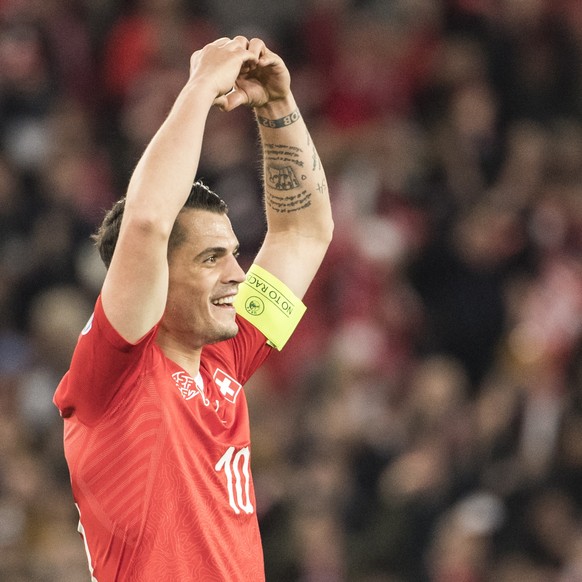 epa07465646 Switzerland&#039;s Granit Xhaka cheers after scoring the 2-0 goal during the UEFA Euro 2020 qualifying Group D soccer match between Switzerland and Denmark at the St. Jakob-Park stadium in ...