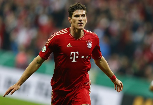 Mario Gomez Bayern Munich's Mario Gomez celebrates after scoring a goal against Wolfsburg during their German soccer cup (DFB Pokal) semi-final match in Munich in this April 16, 2013 file picture. Gomez will not be part of the German soccer squad for the FIFA 2014 World Cup in Brazil, German media reported May 8, 2014. REUTERS/Kai Pfaffenbach/Files (GERMANY - Tags: SPORT SOCCER)
