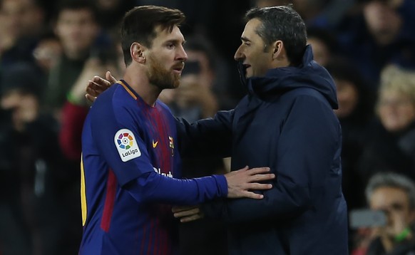 FC Barcelona&#039;s Lionel Messi, left, talks with his coach Ernesto Valverde after been substituted during the Spanish Copa del Rey round of 16 second leg soccer match between FC Barcelona and Celta  ...