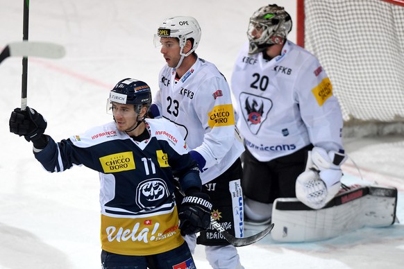 Ambri&#039;s player Johnny Kneubuehler, left, celebrates the 3 - 0 goal, during the preliminary round game of National League A (NLA) Swiss Championship 2020/21 between HC Ambri Piotta against Fribour ...