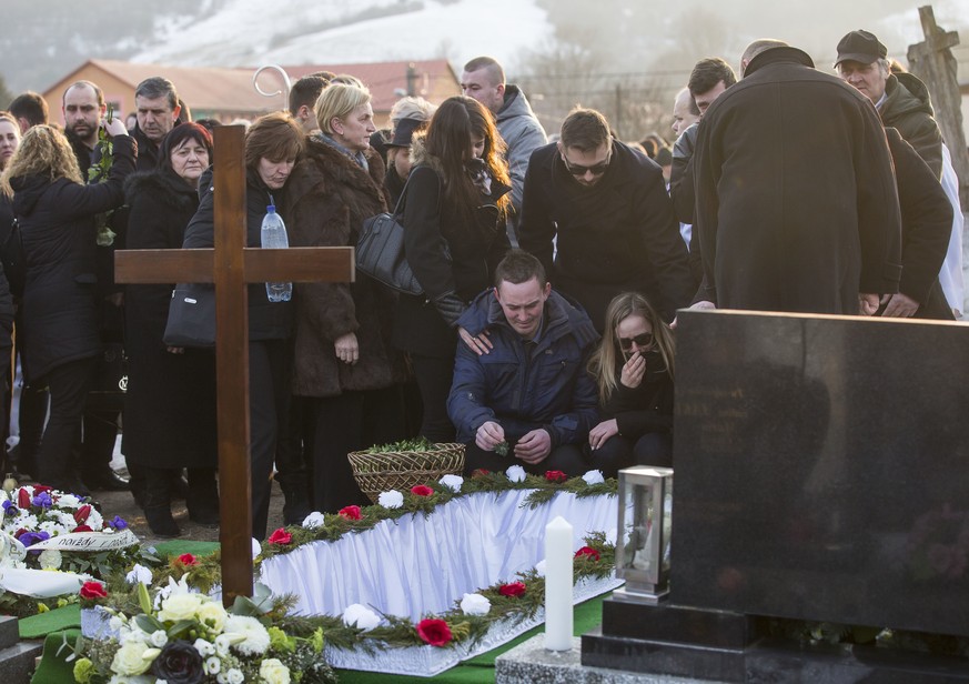 Relatives and friends attend the funeral of investigative journalist Jan Kuciak in Stiavnik, Slovakia on Saturday, March 3, 2018. Kuciak an investigative journalist shot dead in Slovakia last week was ...