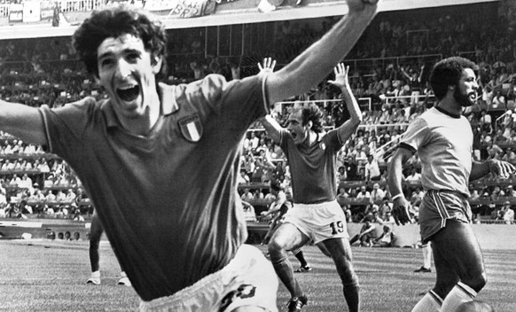 FILE - In this July 5, 1982 file photo, Italy&#039;s Paolo Rossi, left, celebrates, after scoring the second goal for his team during their World Cup match second round soccer match against Brazil, in ...