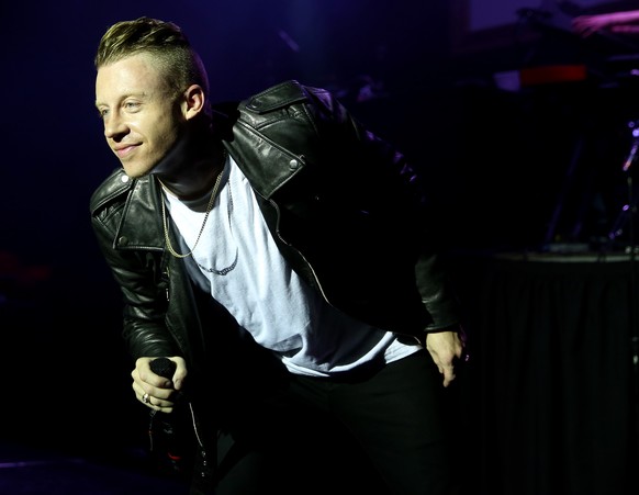 Musician Macklemore performs during a concert presented by T-Mobile at The Belasco Theatre, Thursday, Jan. 23, 2014 in Los Angeles. (Photo by Matt Sayles/Invision/AP)