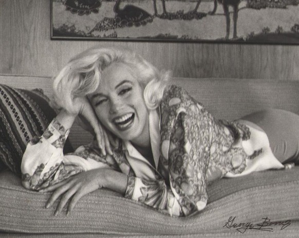 PIC FROM CATERS NEWS - (PICTURED: An old picture of Marilyn lying on a sofa.) - Saucy snaps and never before seen pictures of Marilyn Monroe have gone under the hammer and sold for a whopping 25k. The ...