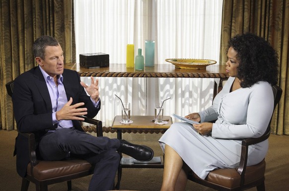 This Monday, Jan. 14, 2013 photo provided by Harpo Studios Inc., shows talk-show host Oprah Winfrey interviewing cyclist Lance Armstrong during taping for the show &quot;Oprah and Lance Armstrong: The ...