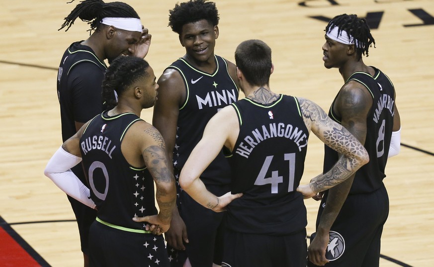 Minnesota Timberwolves forward Anthony Edwards (1) and teammates huddle as time runs down during the fourth quarter of the team&#039;s NBA basketball game against the Houston Rockets on Tuesday, April ...