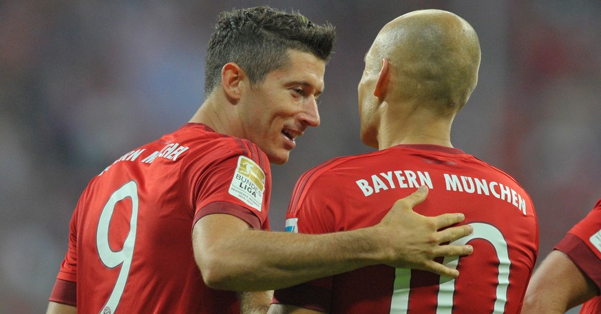 MUNICH, GERMANY - AUGUST 14: Robert Lewandowski (L) and Arjen Robben of FC Bayern Muenchen celebrate scoring their team&#039;s second goal during the Bundesliga match between FC Bayern Muenchen and Ha ...
