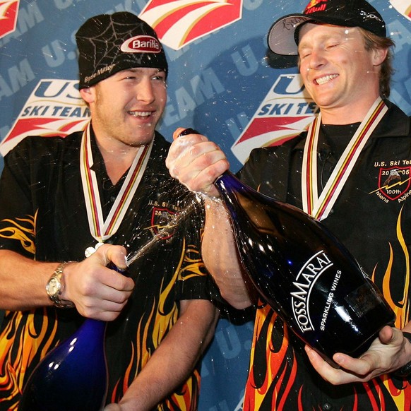U.S. skier Bode Miller, left, and teammate Daron Rahlves spraying sparkling wine during a victory party in the American House in Bormio, northern Italy, Saturday, Feb .5, 2005. Miller won the gold in  ...