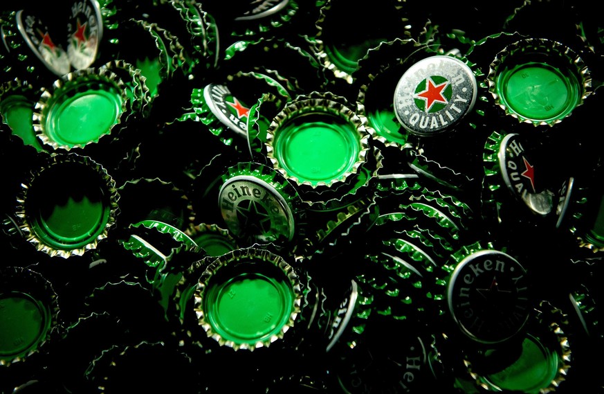 epaselect epa05151093 An archive picture made available on 09 February 2016 of Heineken beer caps during the open day of the Heineken brewery in Zoeterwoude, The Netherlands, 06 June 2015. Dutch beer  ...