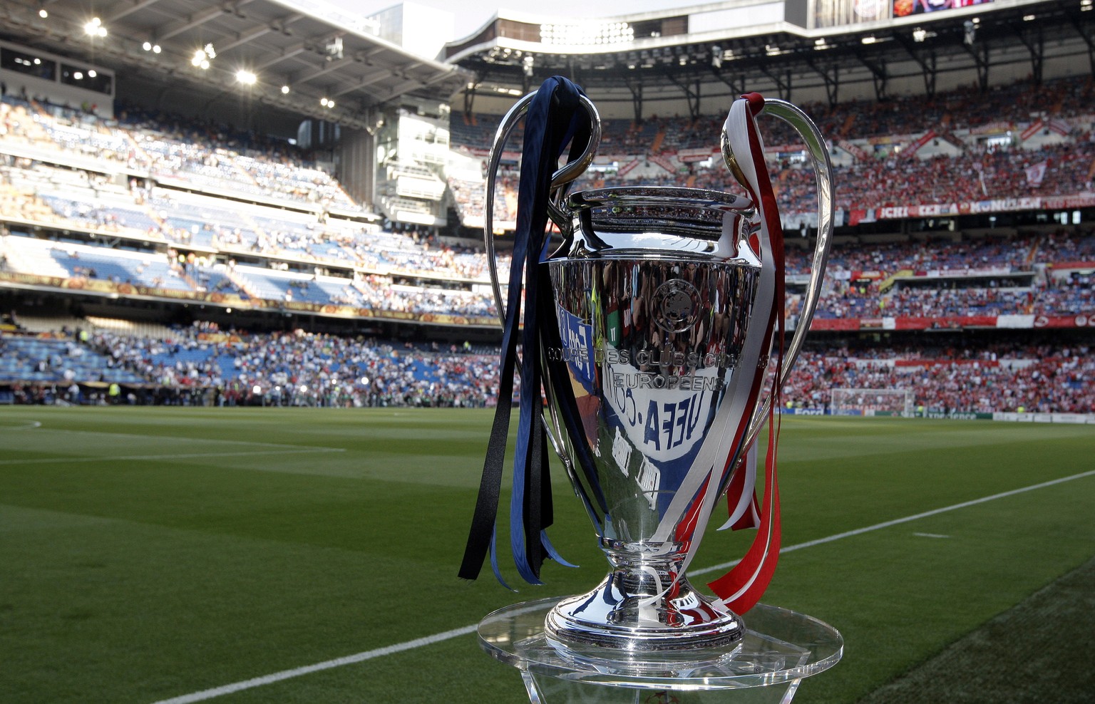 epa07557677 (FILE) - The UEFA Champions League trophy is displayed on the pitch before the UEFA Champions League final between Bayern Munich and Inter Milan at the Santiago Bernabeu stadium in Madrid, ...