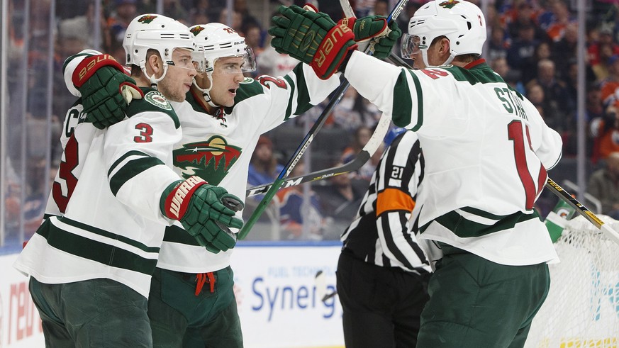Minnesota Wild&#039;s Charlie Coyle (3), Nino Niederreiter (22) and Eric Staal (12) celebrate a goal against the Edmonton Oilers during the first period of an NHL hockey game in Edmonton, Alberta, Sun ...