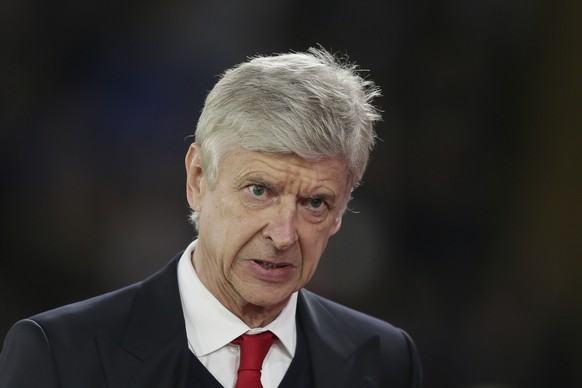 Arsenal manager Arsene Wenger walks to the dugout ahead of the English Premier League soccer match between Crystal Palace and Arsenal at Selhurst Park in London, Monday April 10, 2017. (AP Photo/Tim I ...