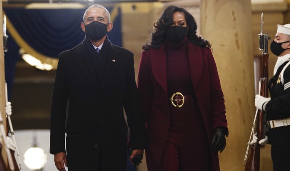 Former US President Barack Obama and Michelle Obama arrive in the Crypt of the US Capitol for President-elect Joe Biden&#039;s inauguration ceremony on Wednesday, Jan. 20, 2021 in Washington. (Jim Lo  ...