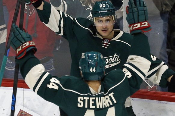Minnesota Wild’s Nino Niederreiter (22), of Switzerland, and Chris Stewart celebrate Niederreiter&#039;s goal against Los Angeles Kings goalie Jonathan Quick in the first period of an NHL hockey game, ...