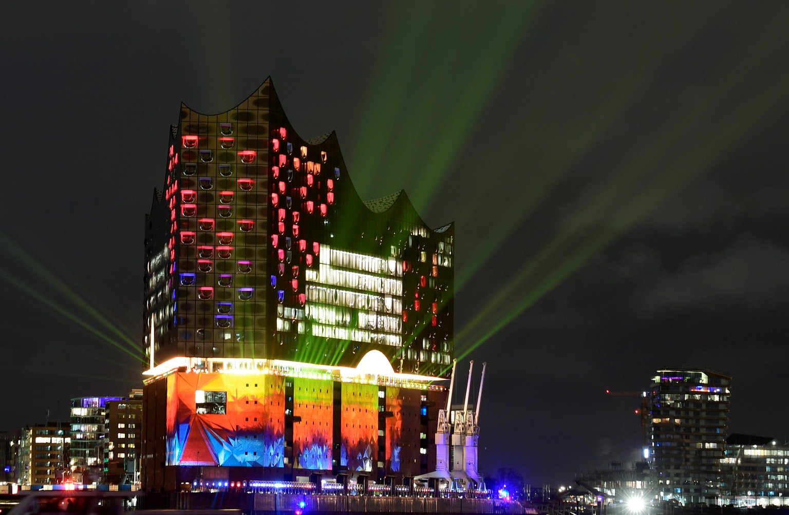 The new Hamburg landmark &quot;Elbphilharmonie&quot; (Philharmonic Hall) along the Elbe river is illuminated during the opening of the new concert hall in Hamburg, northern Germany, January 11, 2017.  ...
