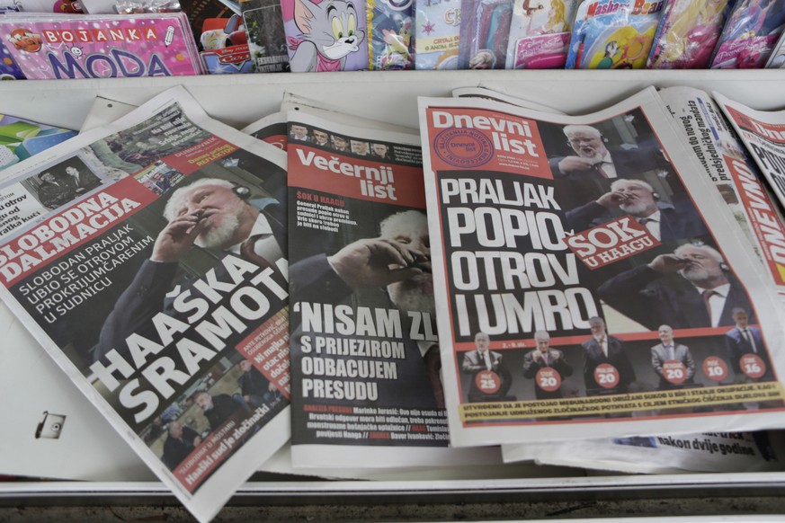 Newspapers on display reporting on Slobodan Praljak, in the southern Bosnian town of Mostar 140 kms south of Sarajevo, Thursday, Nov. 30, 2017. Praljak, a former Bosnian Croatian general died shortly  ...