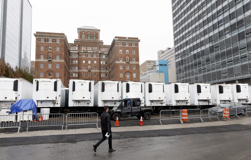 epa08341664 Refrigeration trucks are lined up near the offices of the New York Chief Medical Examiner to serve as an expanded morgue as the city tries to prepare for the large number of people who are ...