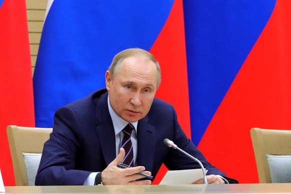 Russian President Vladimir Putin speaks as he chairs a meeting on drafting constitutional changes at the Novo-Ogaryovo residence outside Moscow, Russia, Thursday, Jan. 16, 2020. Putin proposed a set o ...