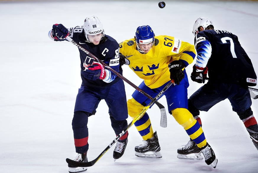 Patrick Kane and Derek Ryan of USA against Rickard Rakell of Sweden during the IIHF World Championship semi-final ice hockey match between Sweden and USA in Royal Arena in Copenhagen, Denmark, Saturda ...