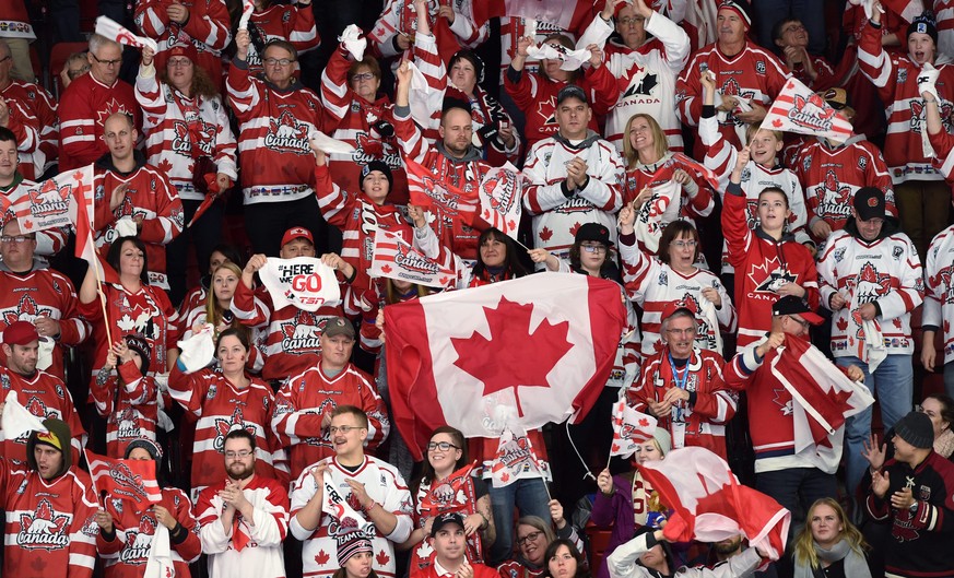 Canada fans celebrate in the stands after a goal by Canada&#039;s Anthony Beauvillier against Denmark during first-period preliminary hockey game action at the IIHF World Junior Ice Hockey Championshi ...