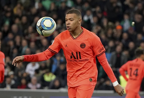 PSG&#039;s Kylian Mbappe controls the ball during the French League One soccer match between Saint-Etienne and Paris Saint-Germain, at the Geoffroy Guichard stadium, in Saint-Etienne, central France,  ...