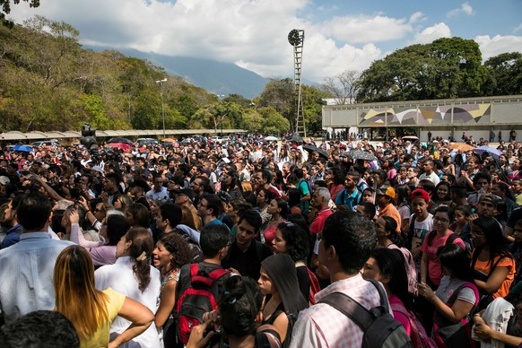 epa07307108 Hundreds of people listen to the President of the National Assembly (AN, Parliament) Juan Guaido during an act at the Central University of Venezuela (UCV), in Caracas, Venezuela, 21 Janua ...