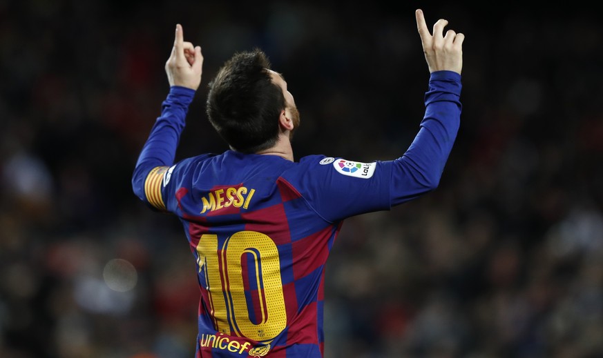 Barcelona&#039;s Lionel Messi celebrates after scoring the opening goal during a Spanish La Liga soccer match between Barcelona and Granada at Camp Nou stadium in Barcelona, Spain, Sunday, Jan. 19, 20 ...
