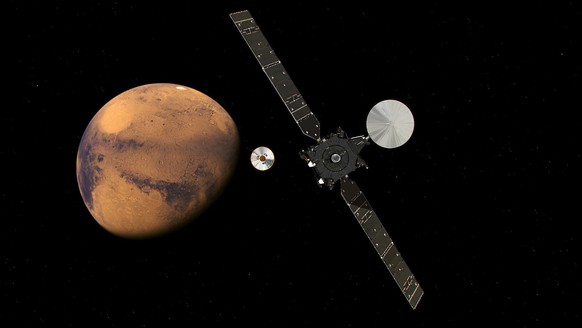 epa05585537 A handout image released on 19 February 2016 by the European Space Agency (ESA) shows an artist&#039;s impression of the ExoMars Trace Gas Orbiter (TGO) and its entry, descent and landing  ...