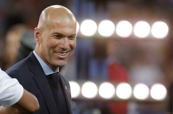 FILE - In this May 26, 2018 photo Real Madrid coach Zinedine Zidane smiles after winning the Champions League Final soccer match between Real Madrid and Liverpool at the Olimpiyskiy Stadium in Kiev. ( ...