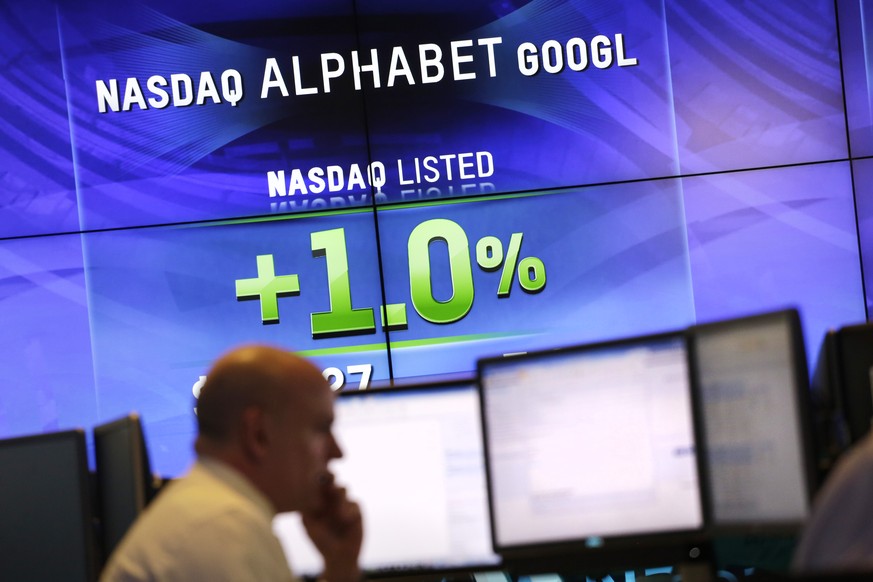 Electronic screens post the price of Alphabet stock, Monday, Feb. 1, 2016, at the Nasdaq MarketSite in New York. Alphabet, the parent company of Google, reports quarterly earnings Monday. (AP Photo/Ma ...