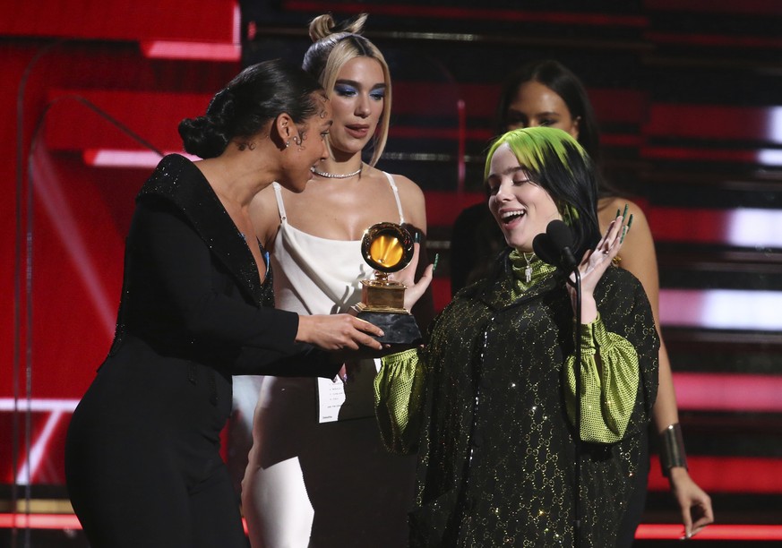 Alicia Keys, from left, and Dua Lipa present Billie Eilish with the award for best new artist at the 62nd annual Grammy Awards on Sunday, Jan. 26, 2020, in Los Angeles. (Photo by Matt Sayles/Invision/ ...