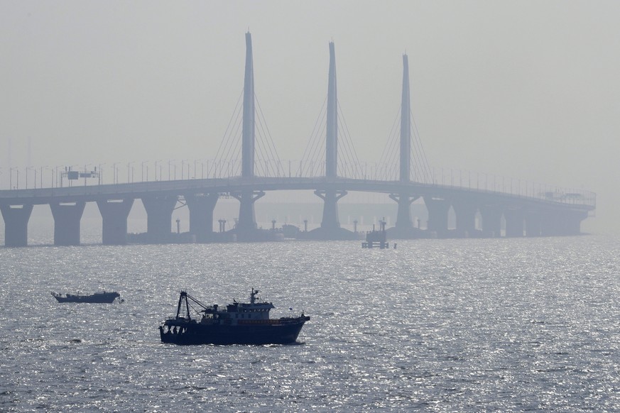 A boat sails near the Hong Kong-Zhuhai-Macau Bridge, in Zhuhai city, south China&#039;s Guangdong province, Wednesday, March 28, 2018. The Hong Kong-Zhuhai-Macau Bridge, the world&#039;s longest cross ...