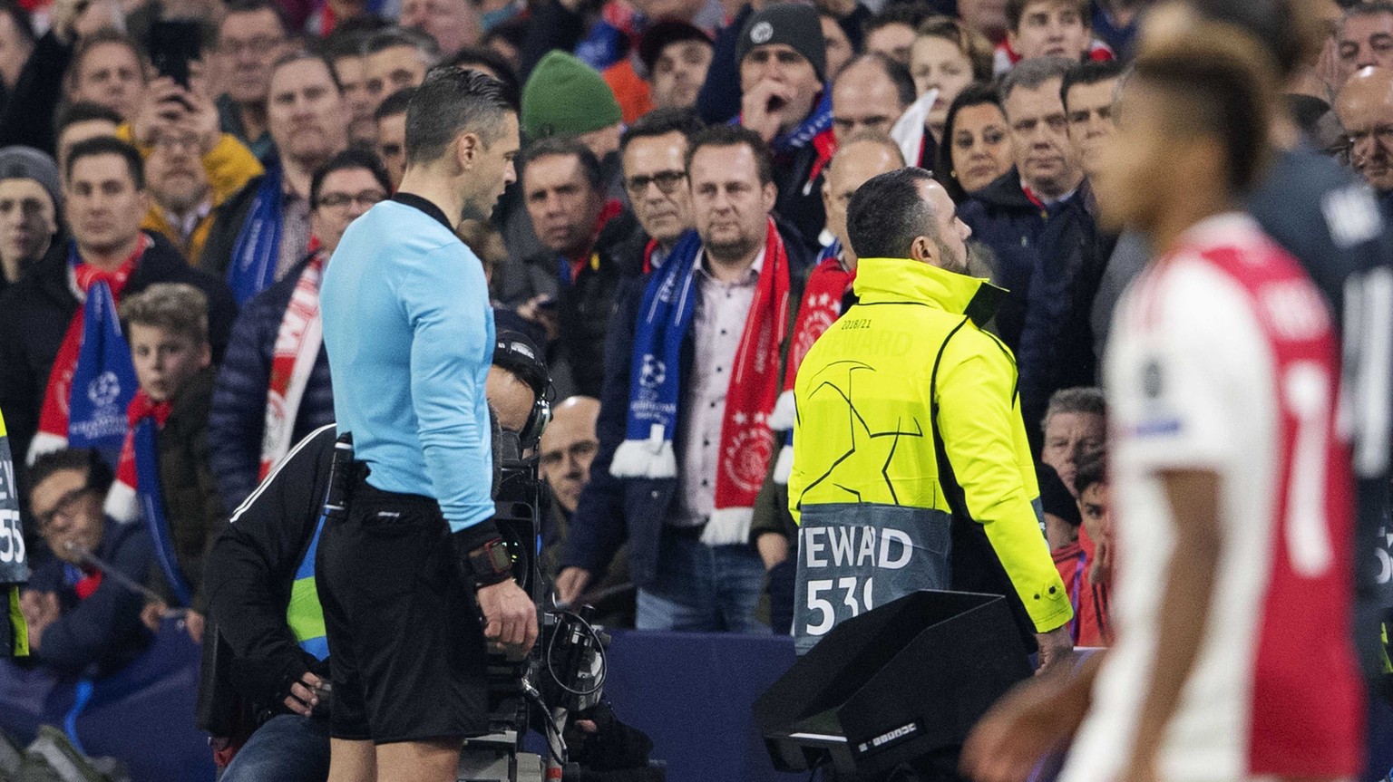 epa07367928 Referee Damira Skomina watches images on the VAR during the UEFA Champions League round of 16 first leg soccer match between Ajax Amsterdam and Real Madrid in AMsterdam, Netherlands, 13 Fe ...