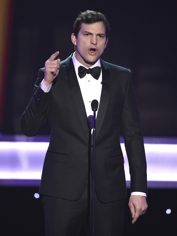 Ashton Kutcher presents the award for outstanding performance by a female actor in a comedy series at the 23rd annual Screen Actors Guild Awards at the Shrine Auditorium &amp; Expo Hall on Sunday, Jan ...