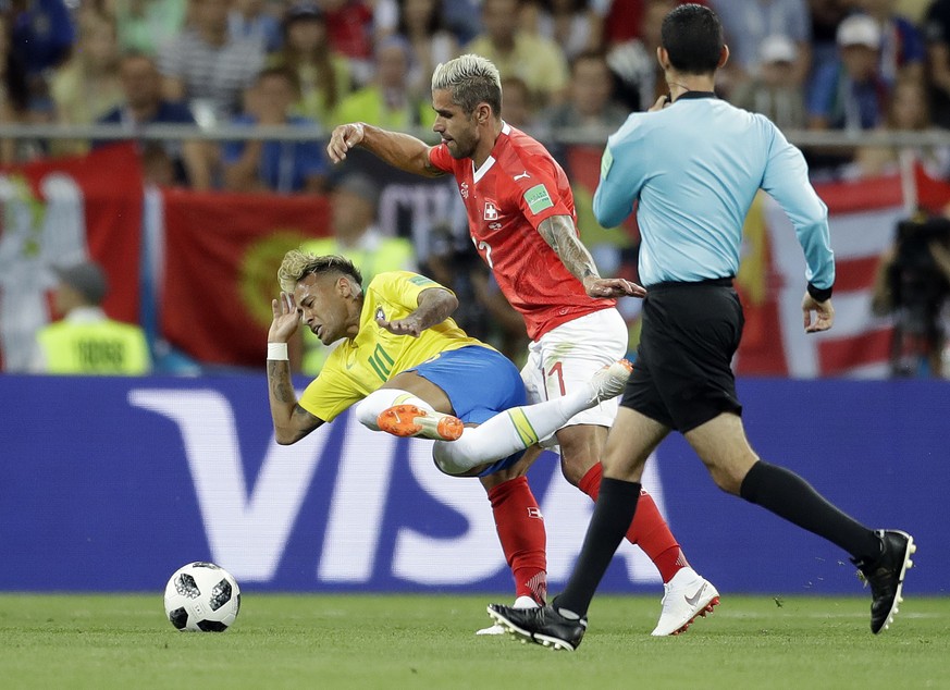 Brazil&#039;s Neymar, left, and Switzerland&#039;s Valon Behrami challenge for the ball during the group E match between Brazil and Switzerland at the 2018 soccer World Cup in the Rostov Arena in Rost ...